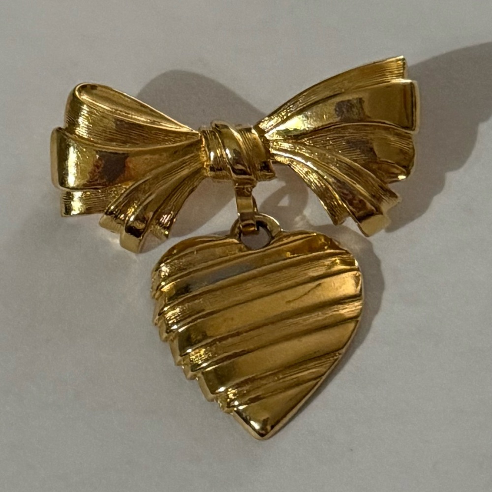 Gold Bow Brooch with Hanging Heart.